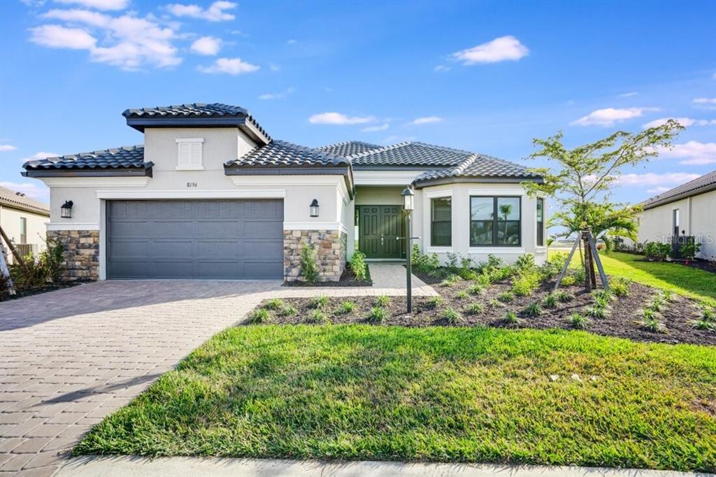 front view of a house with a yard