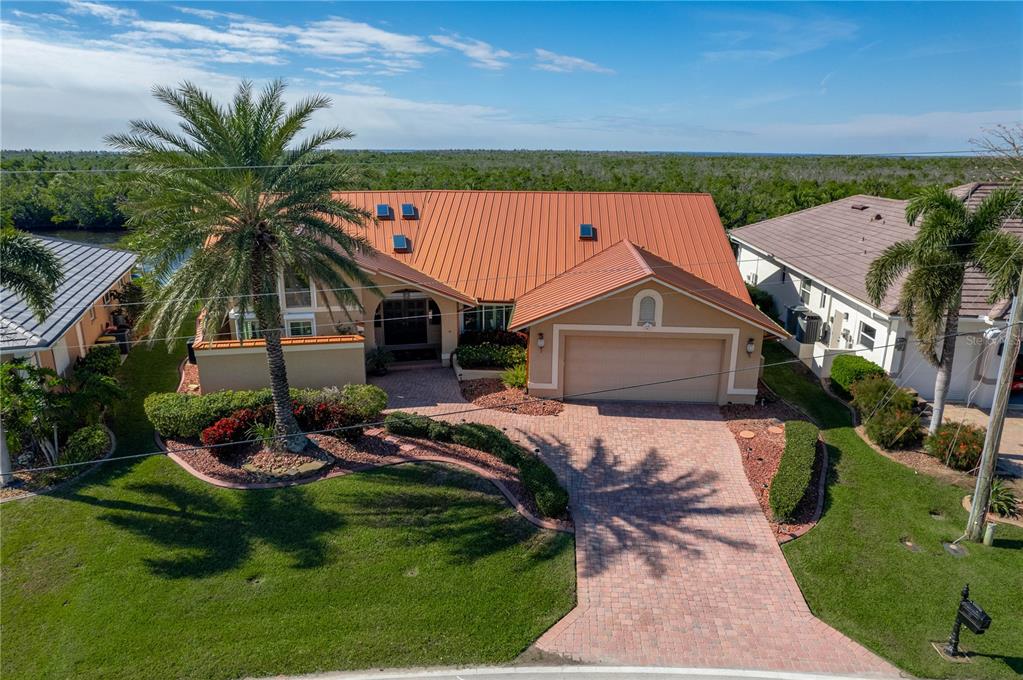 a house with lots of trees in the background