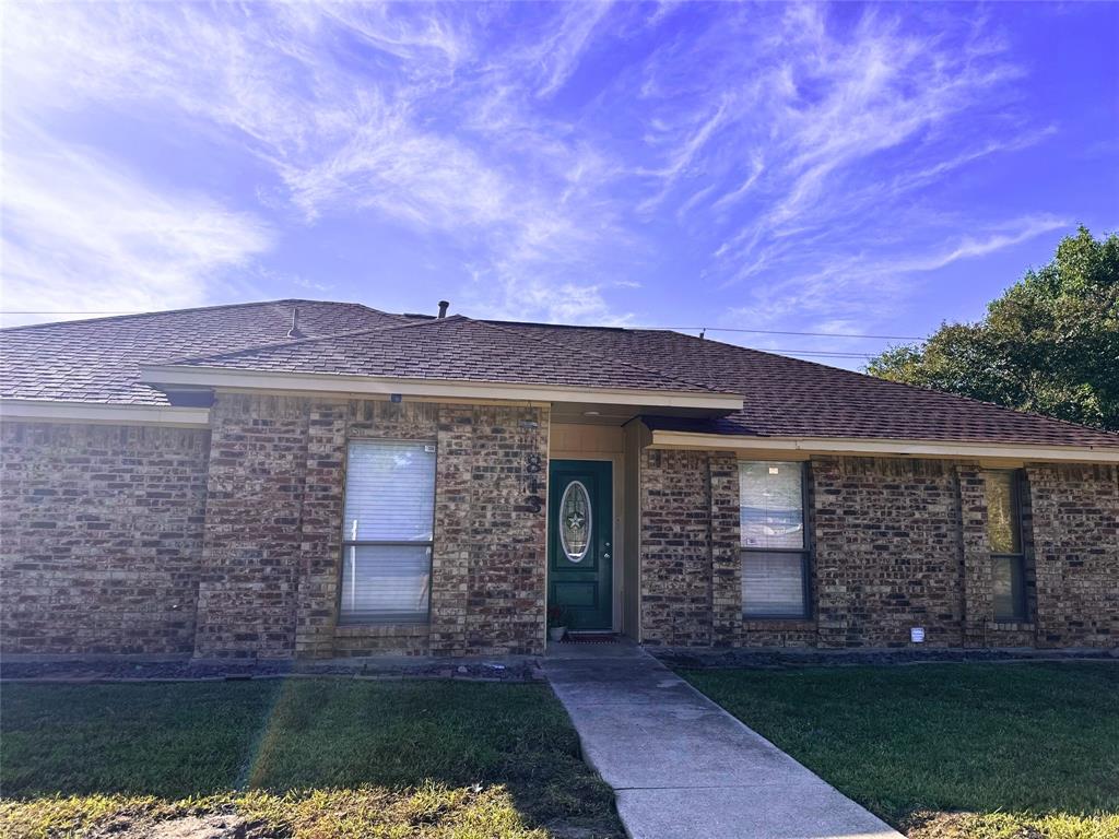 front view of a house with a yard