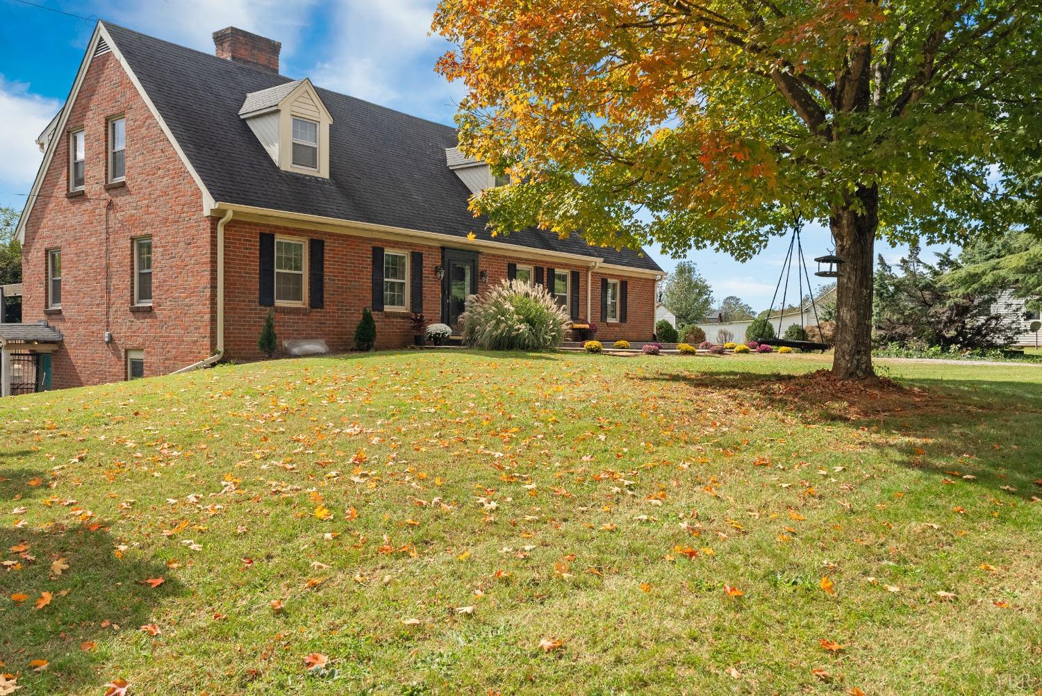 a view of a yard in front of a brick building