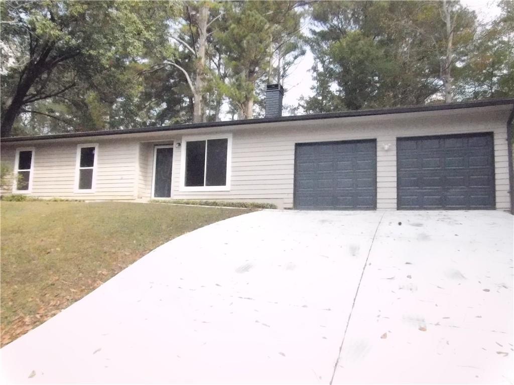 a house with trees in the background