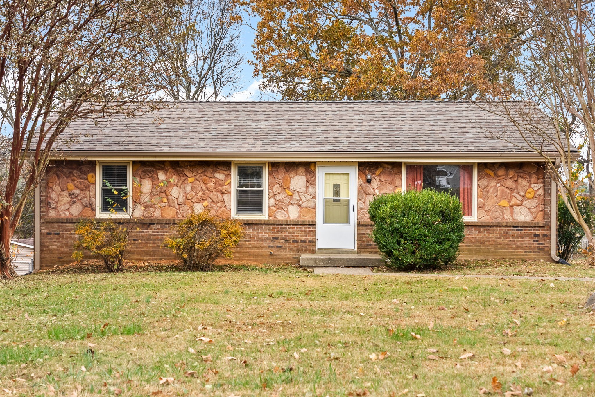 a front view of a house with a yard