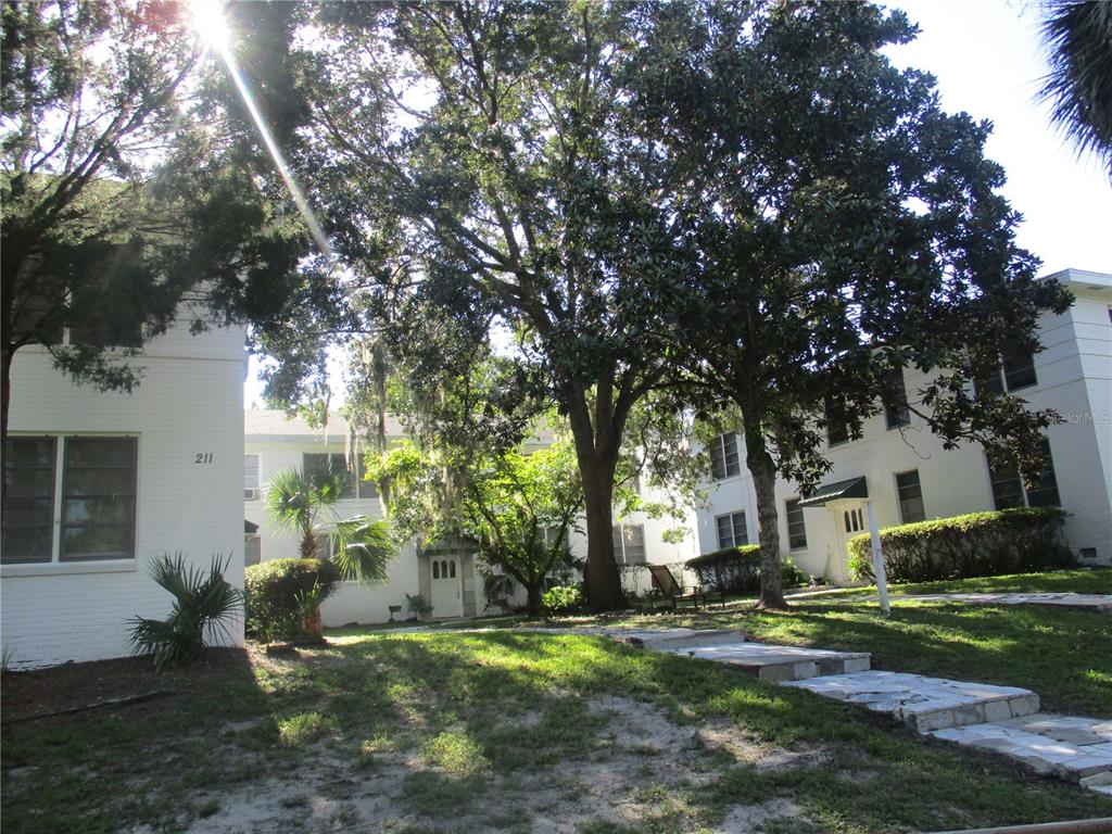 a view of a house with a yard