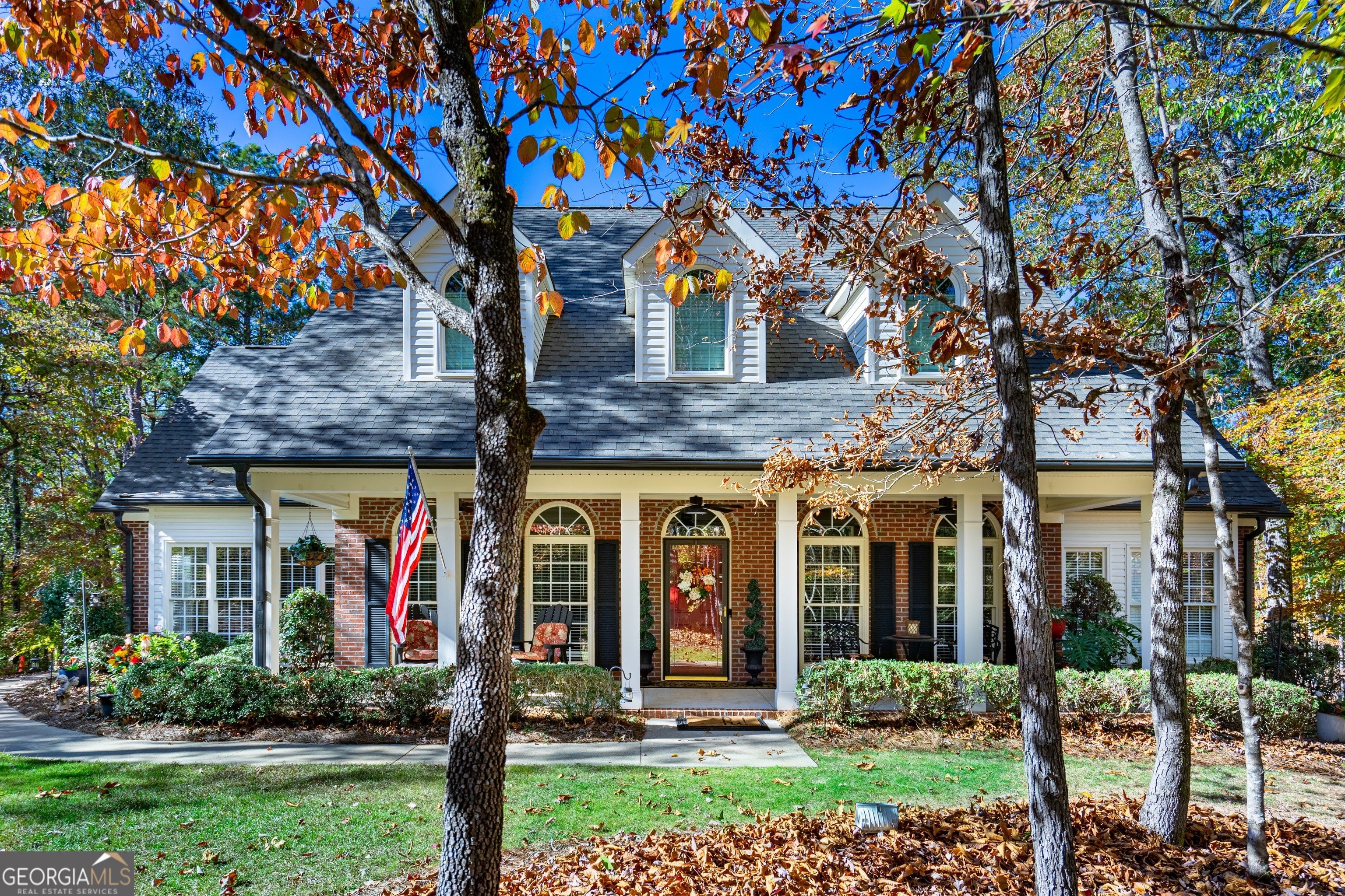 front view of a house with a tree