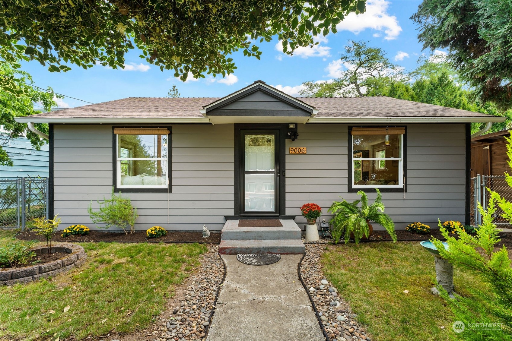 a front view of a house with garden