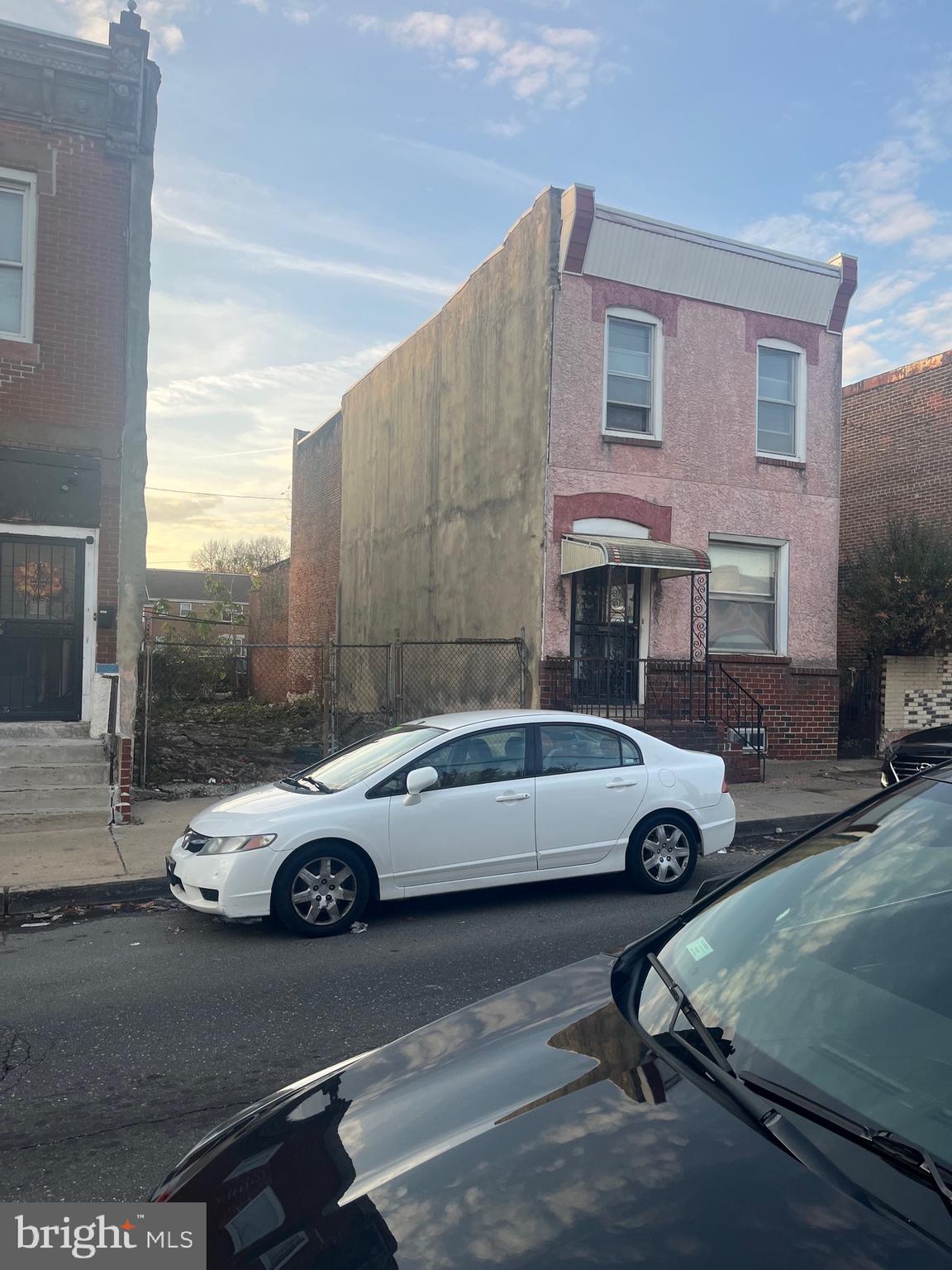 a car parked in front of a house