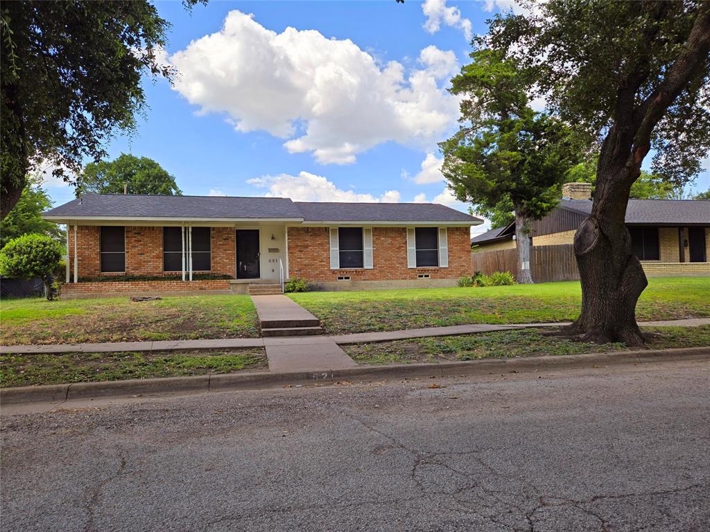 front view of a house with a yard