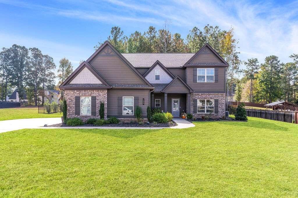 a front view of a house with a yard