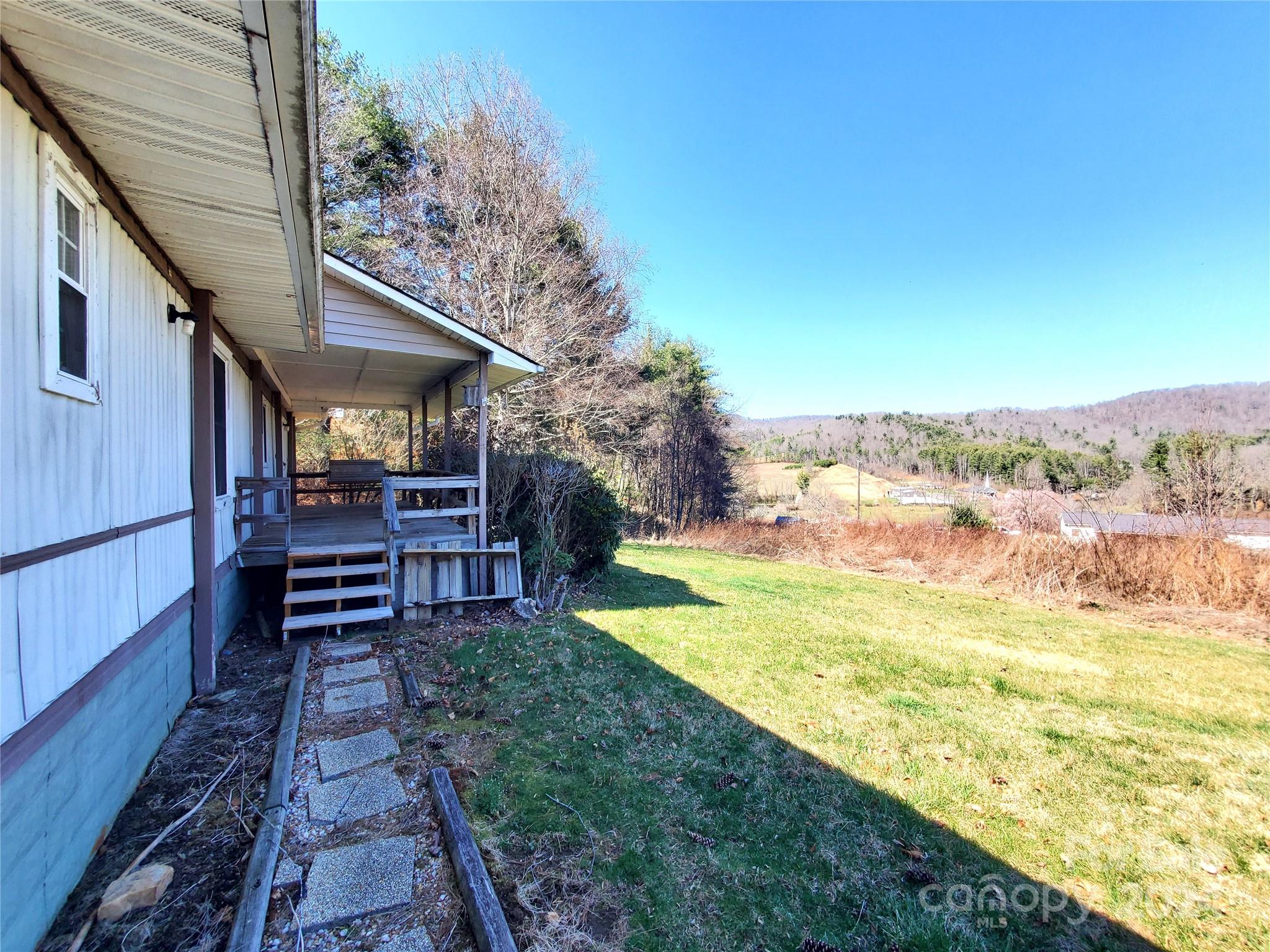 a view of a backyard with sitting area