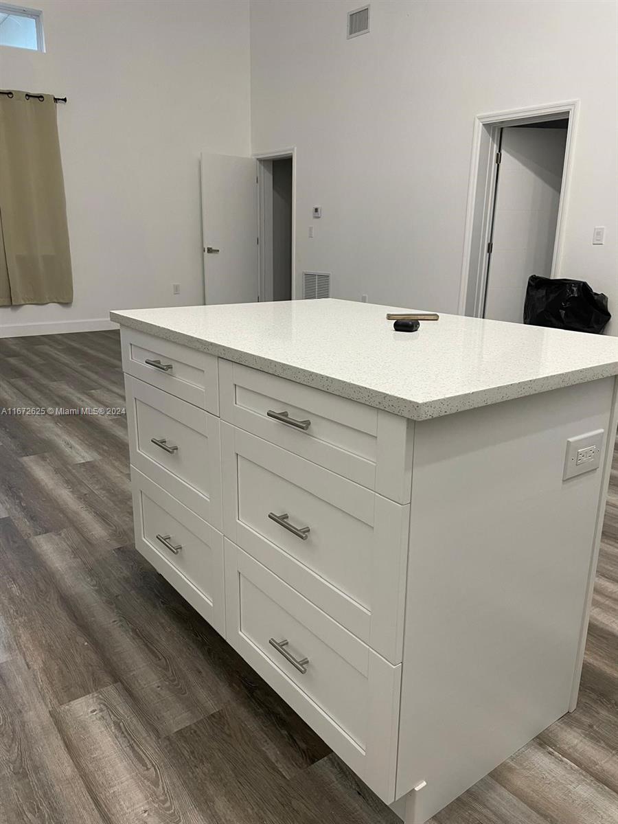 a bathroom with a sink and mirror