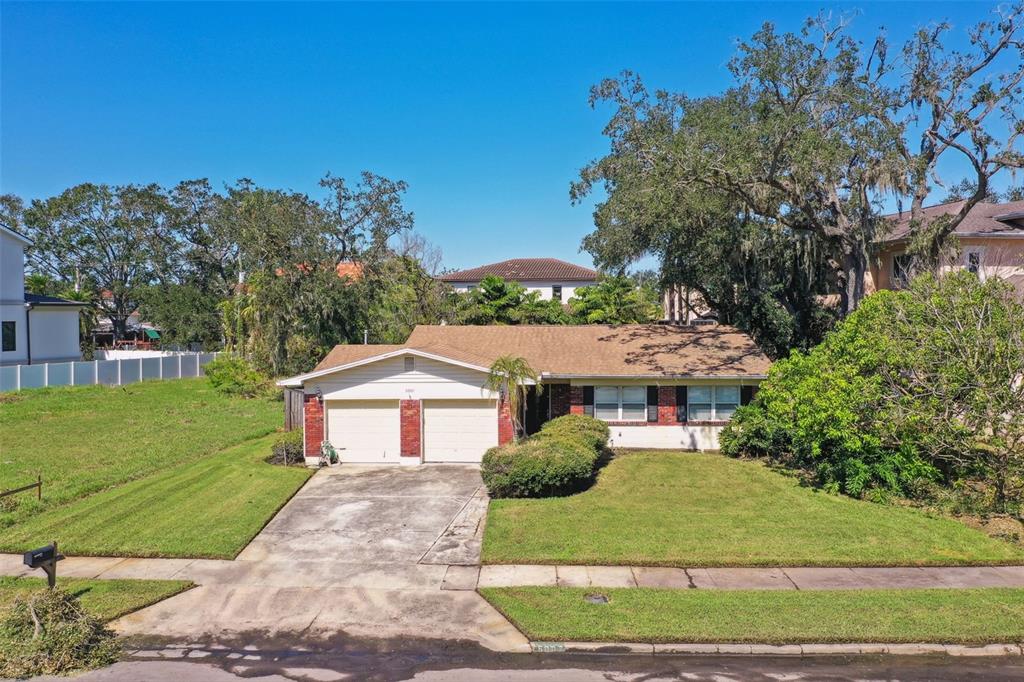 a aerial view of a house with a yard