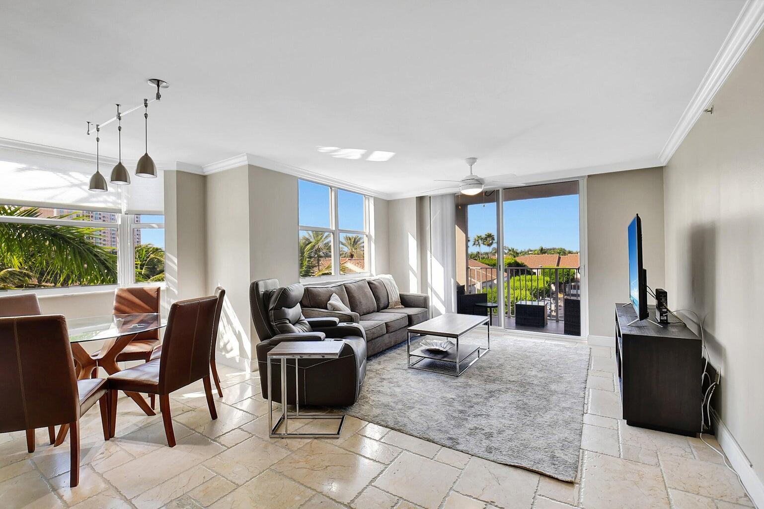 a living room with furniture a window and gym equipment