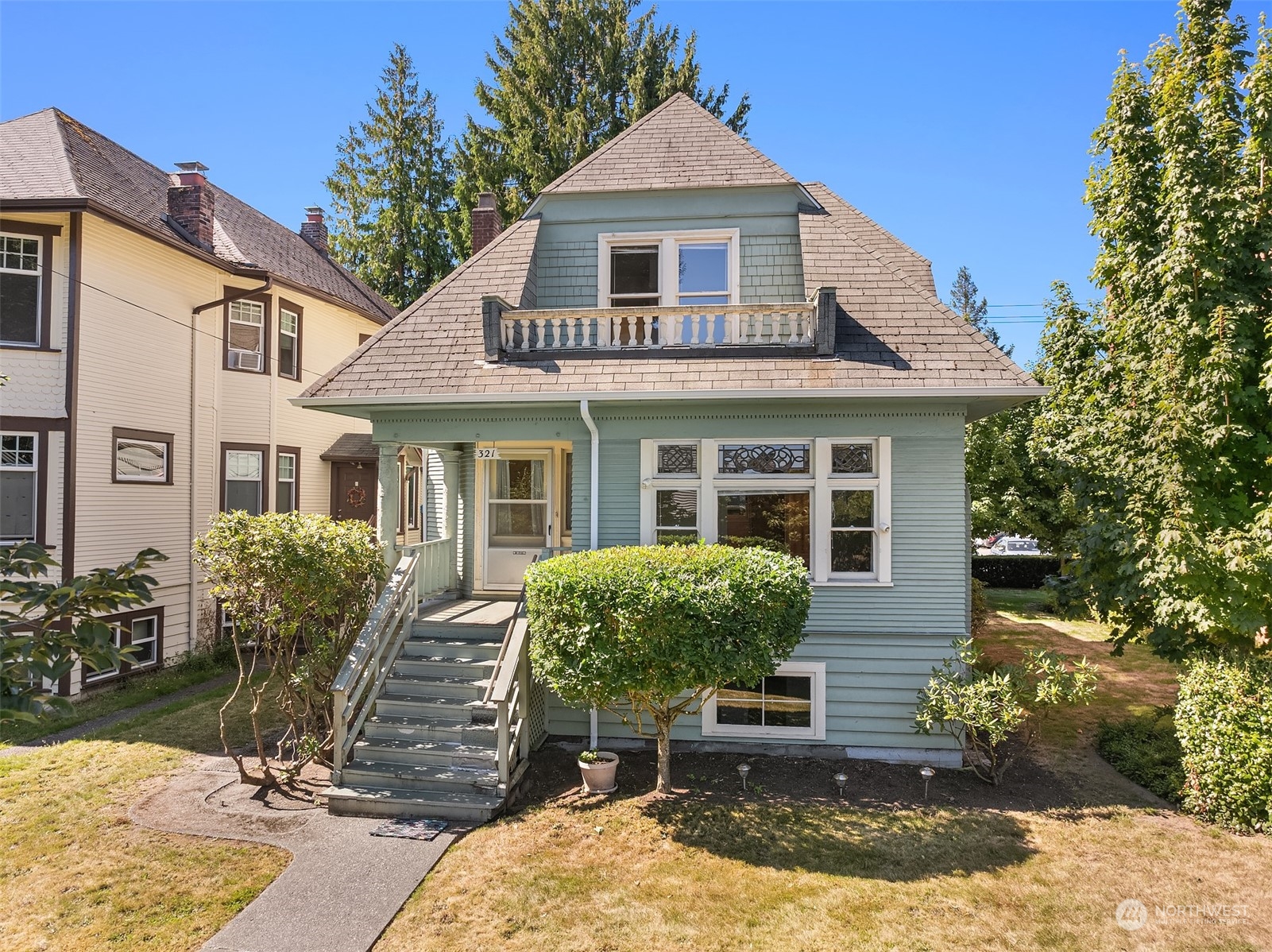 front view of a house with a yard