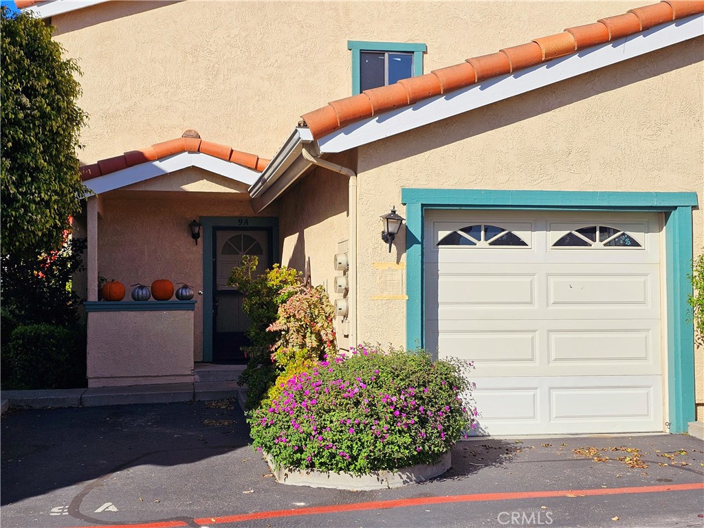 a front view of a house with a garage