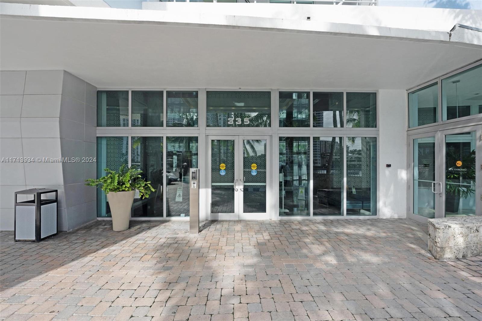 a view of a building with potted plants