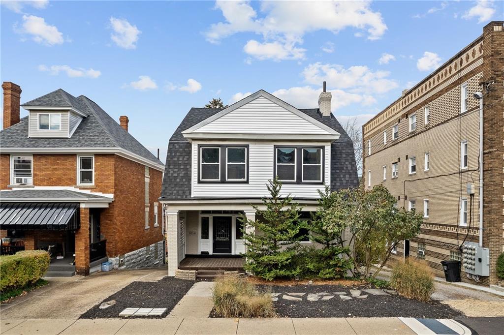 a front view of a house with a yard