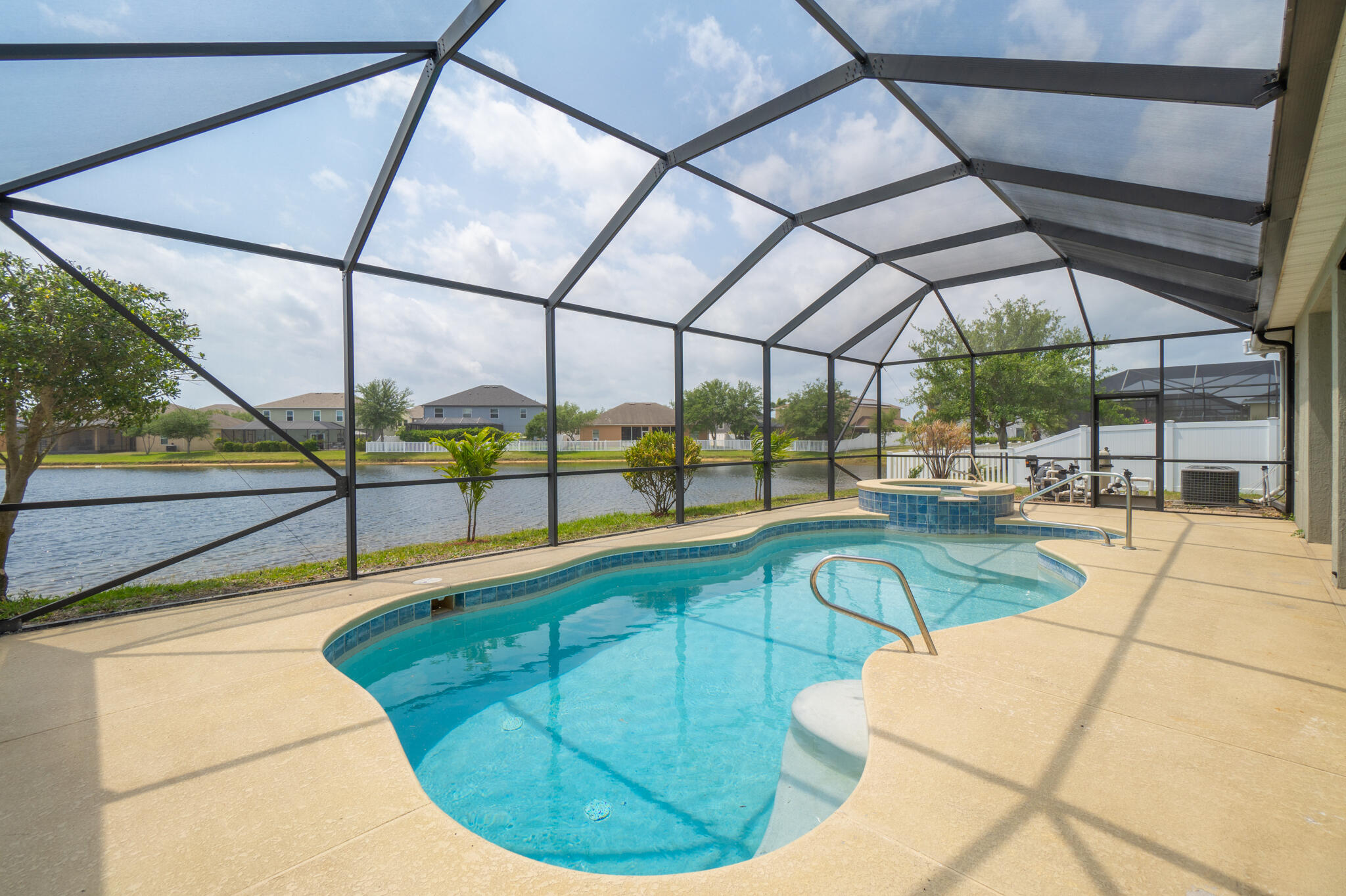 a view of a swimming pool with a chairs