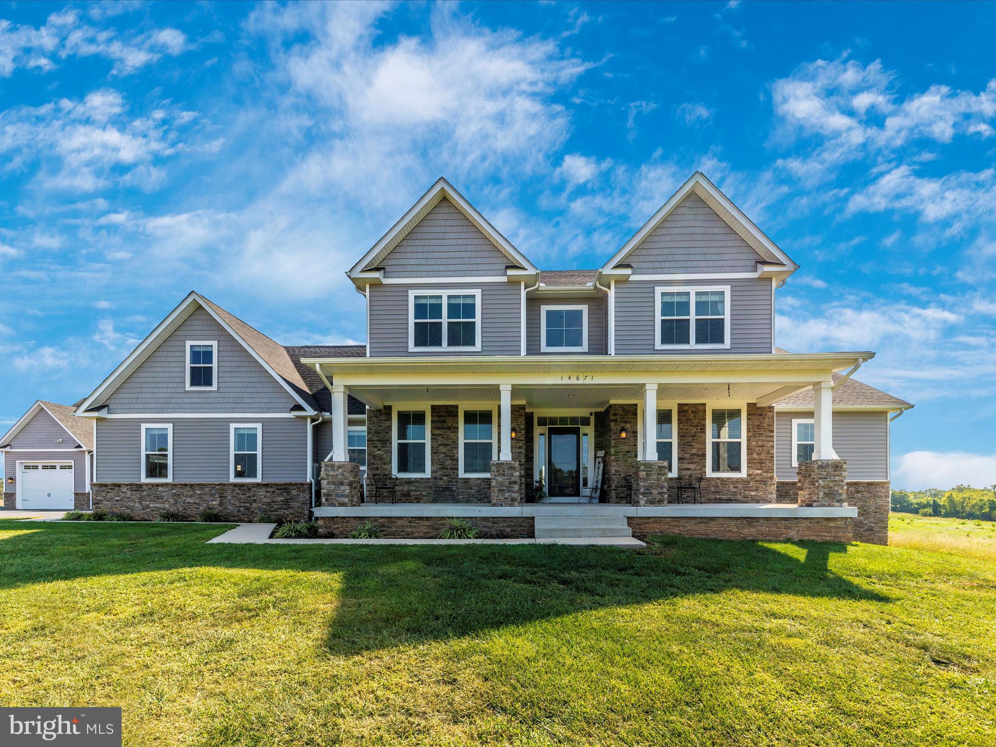 front view of a house with a yard