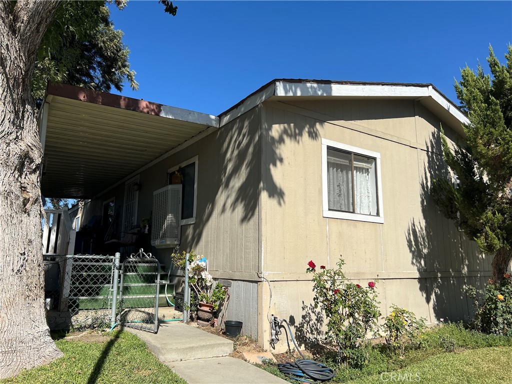 a view of a house with a small yard