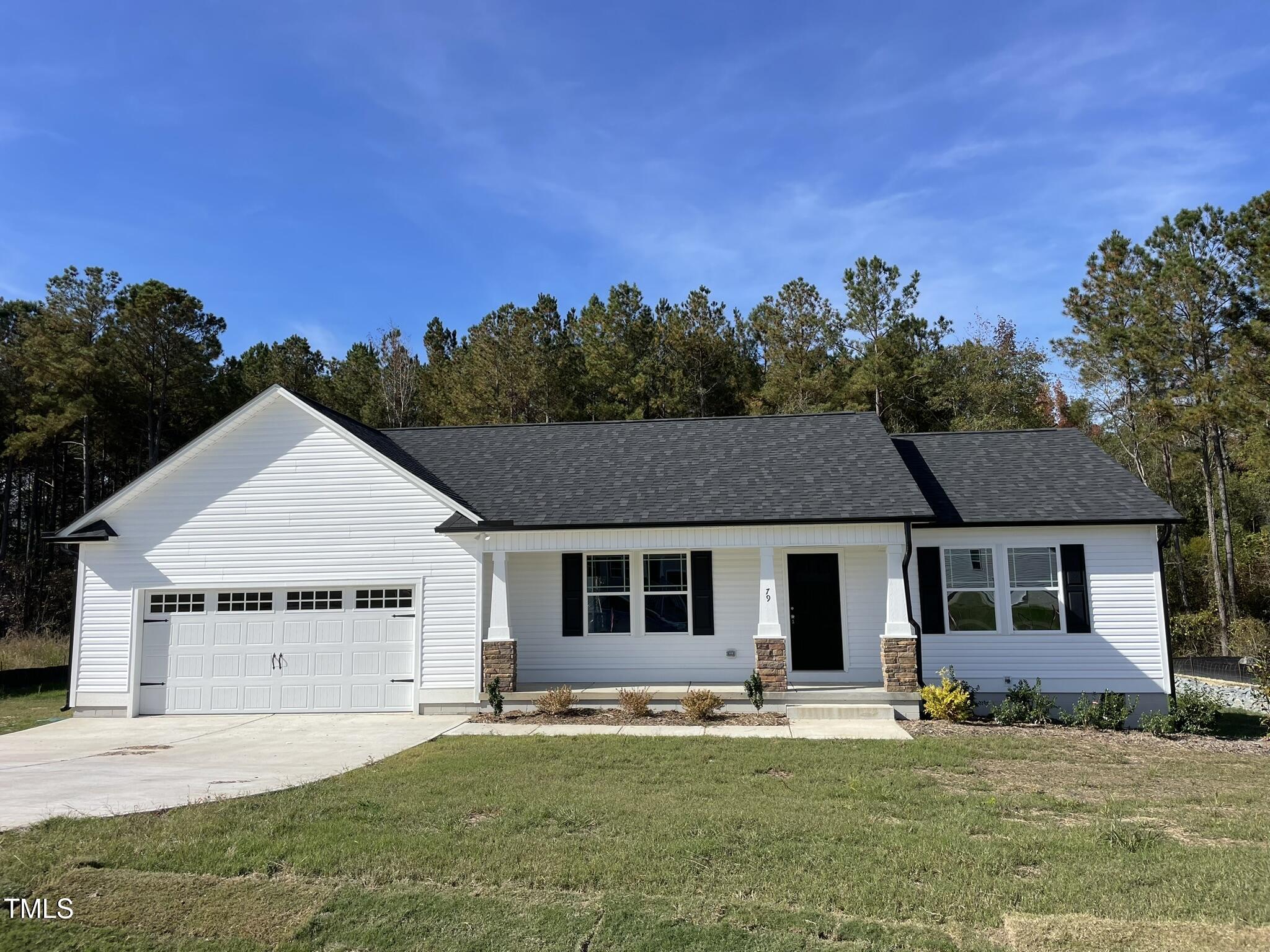 front view of a house with a yard