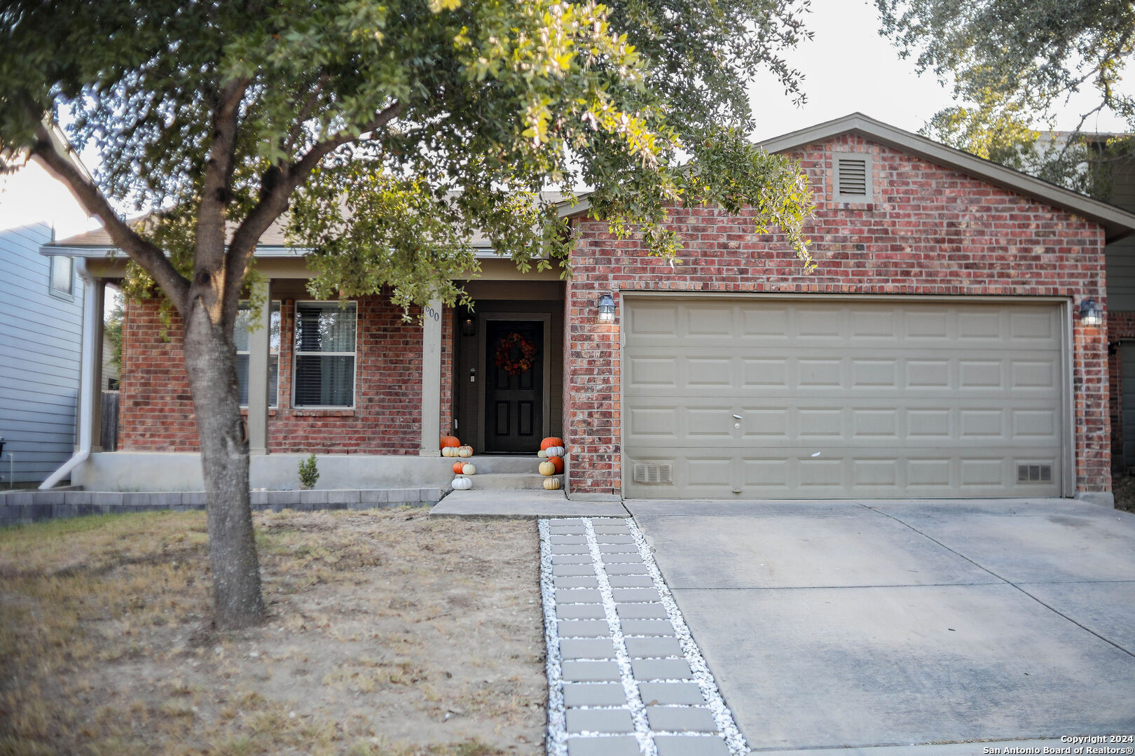 a front view of a house with garden