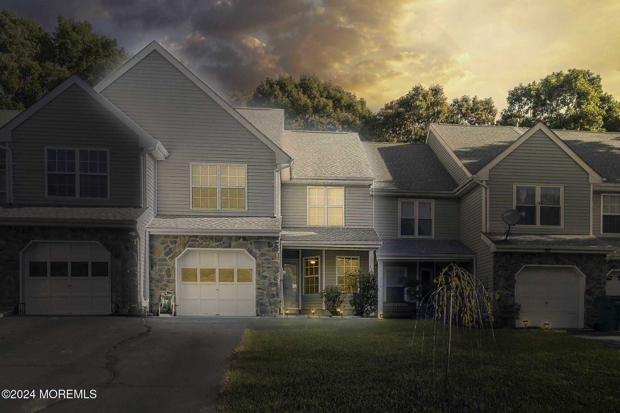 a front view of a house with a yard