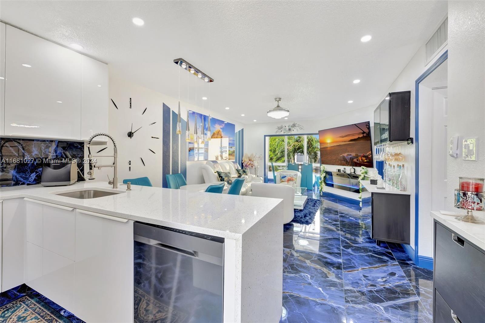 a large kitchen with a table and chairs