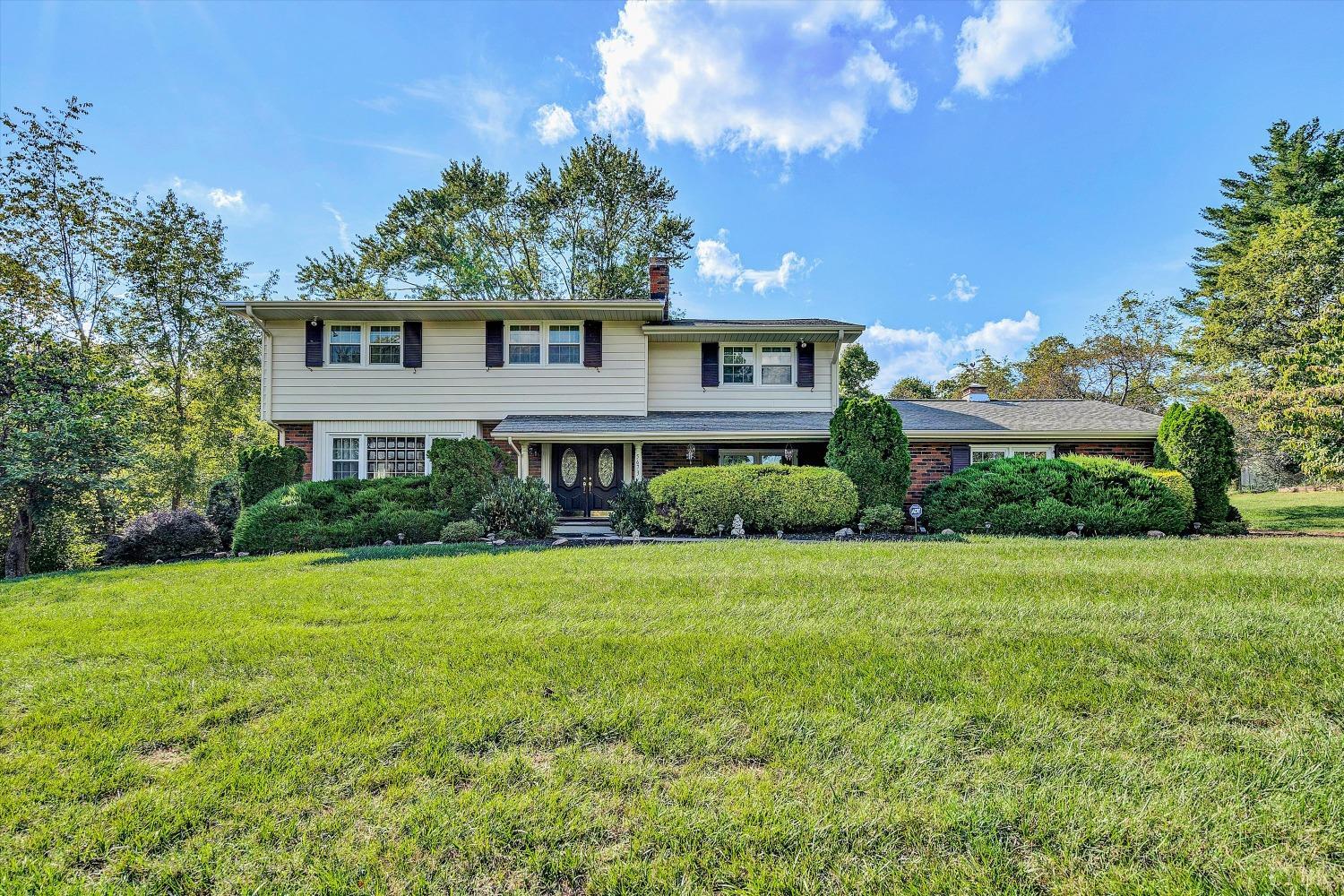 a front view of a house with a yard