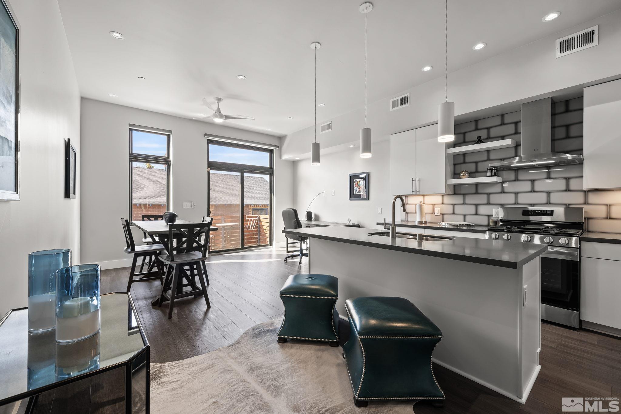 a kitchen with stainless steel appliances granite countertop a stove and a sink