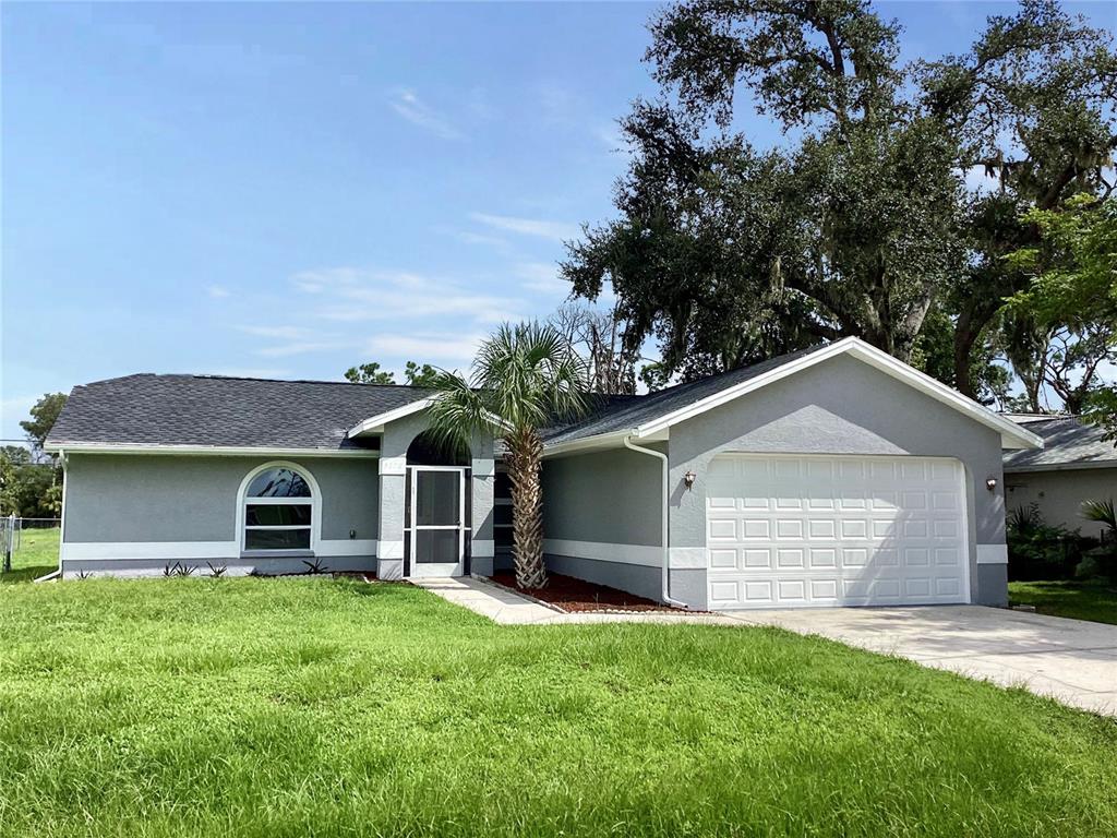 front view of a house with a yard