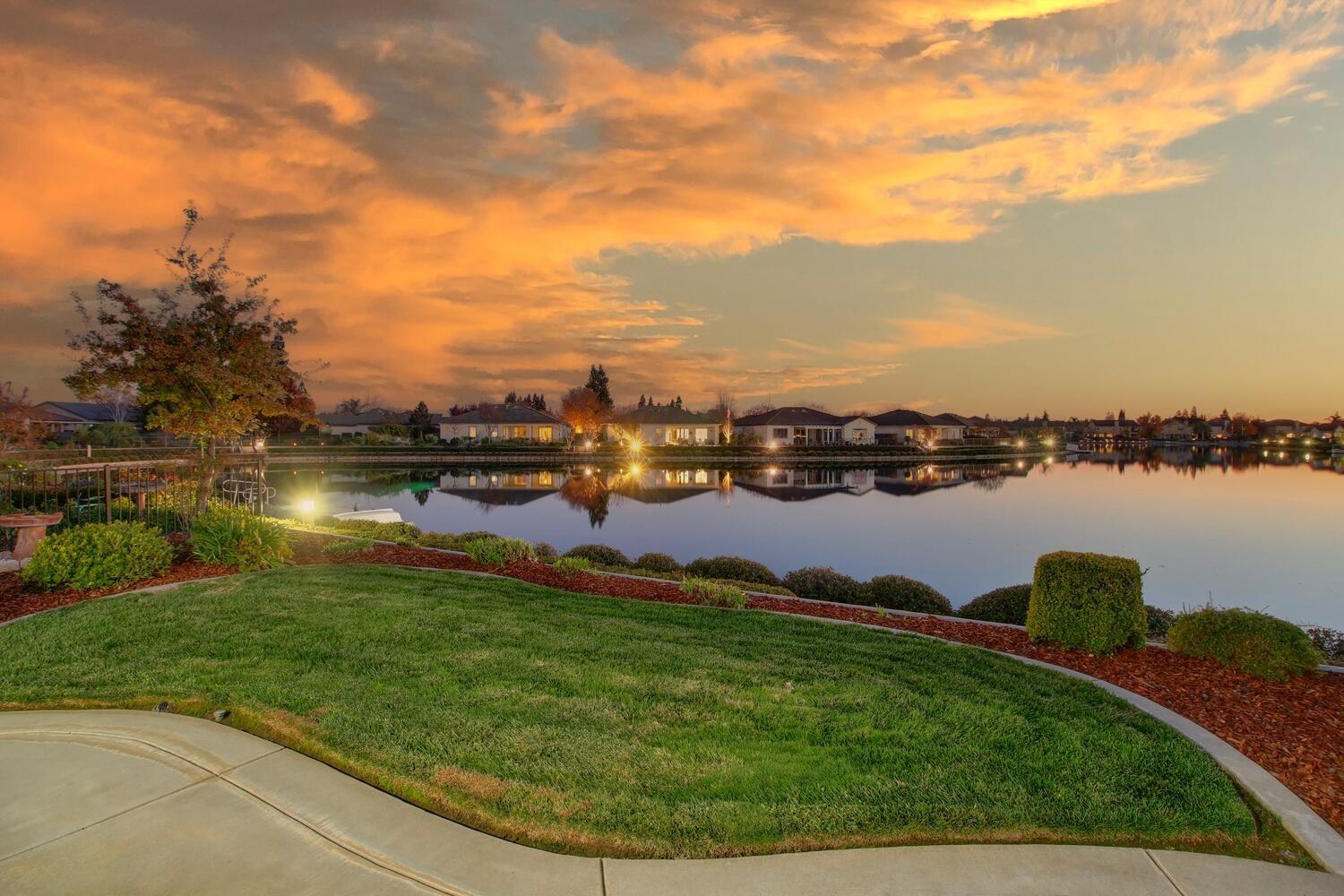 a view of a lake with houses in the back