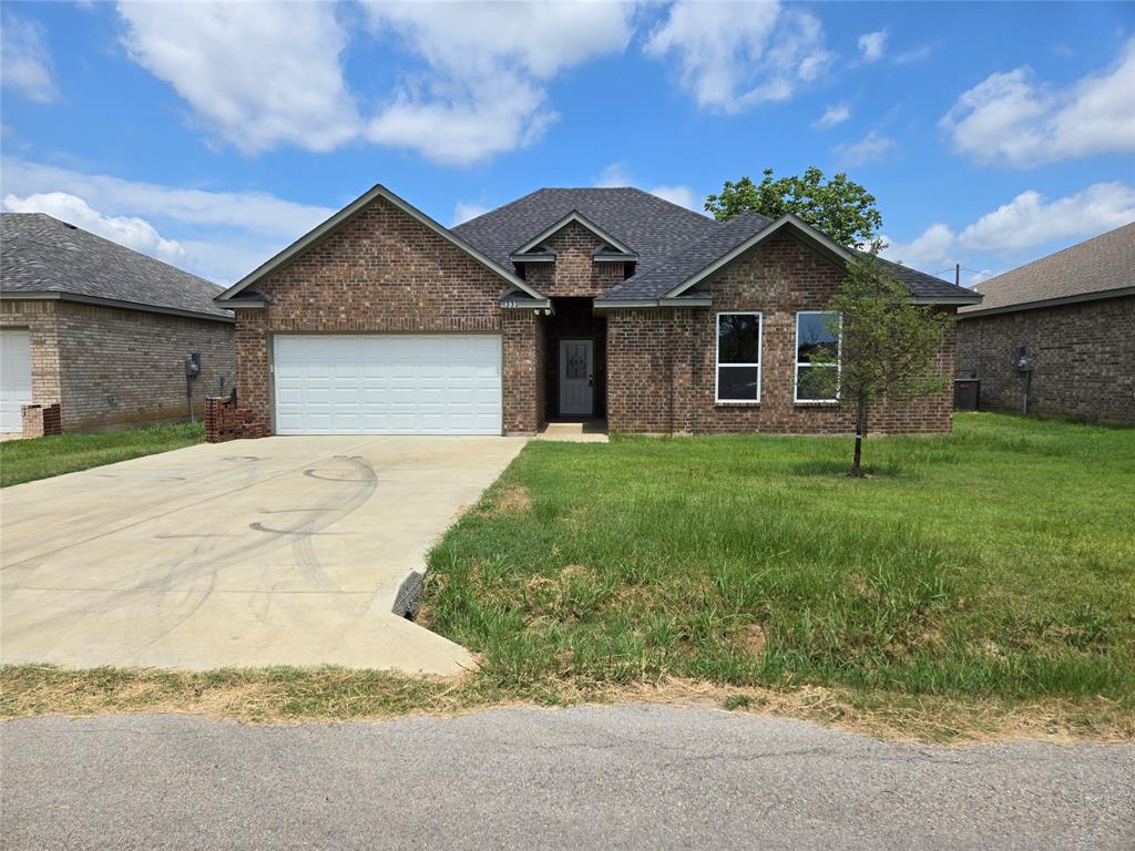 a front view of a house with yard