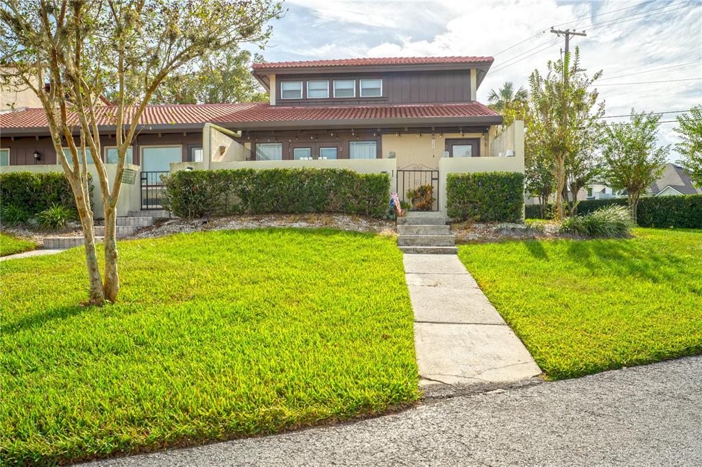 a view of house with yard