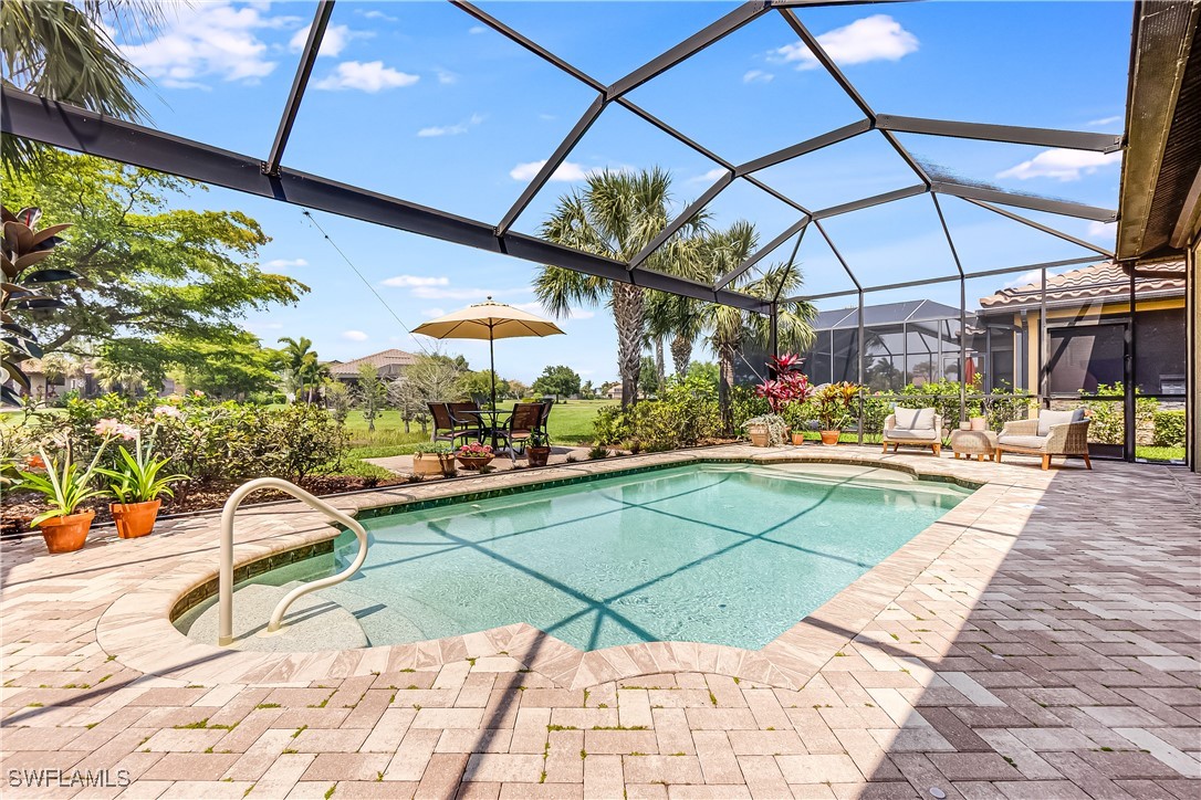 a view of a swimming pool with a patio