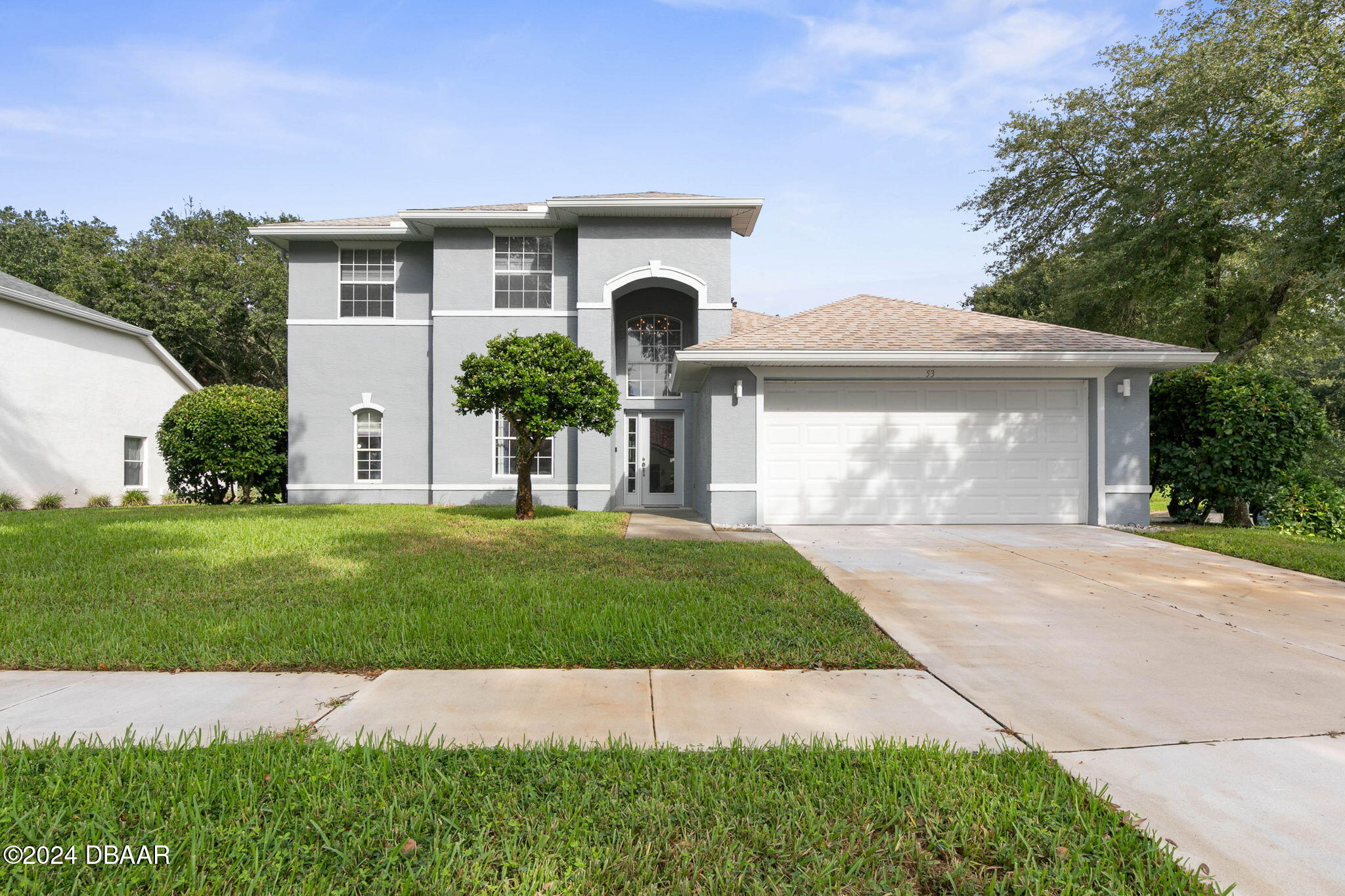 front view of a house with a yard