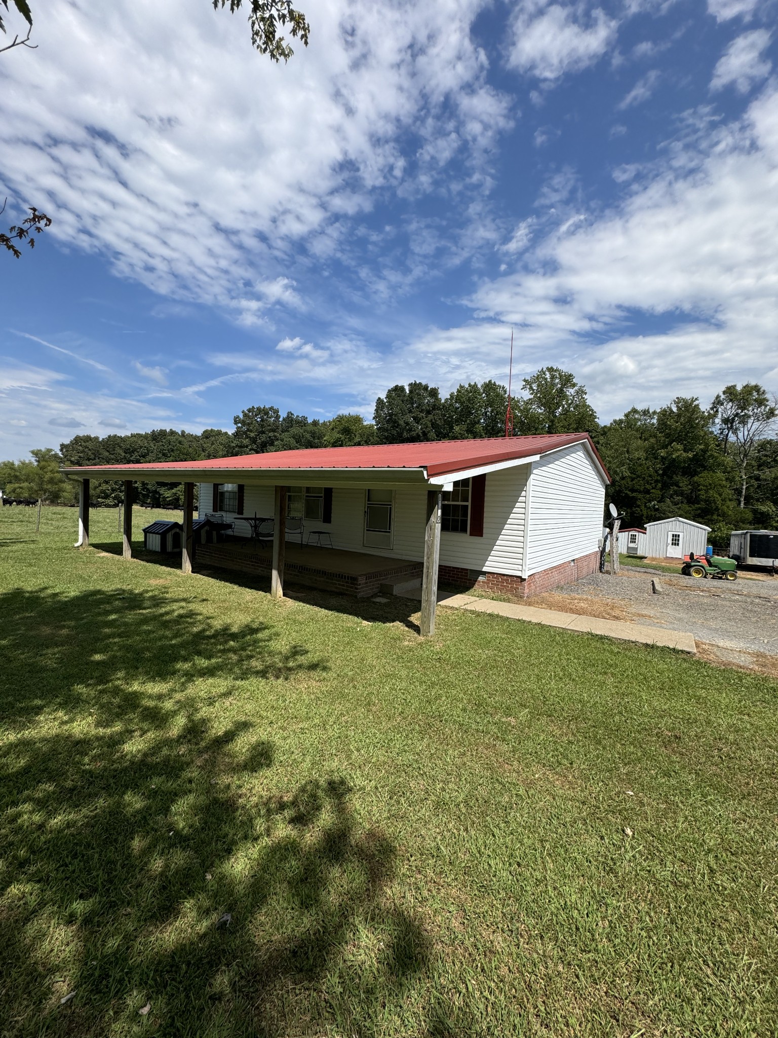 a view of house with yard