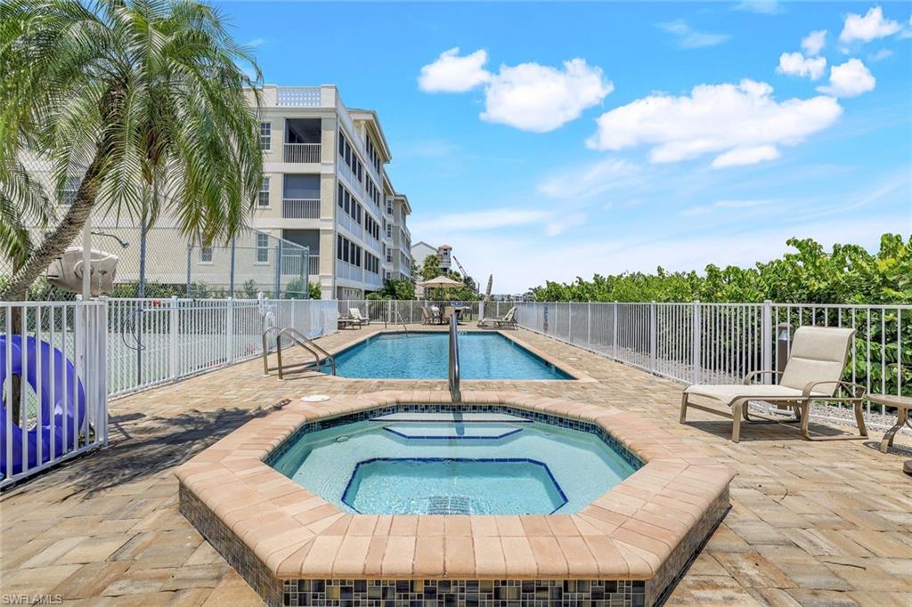 a view of a swimming pool with a lounge chair