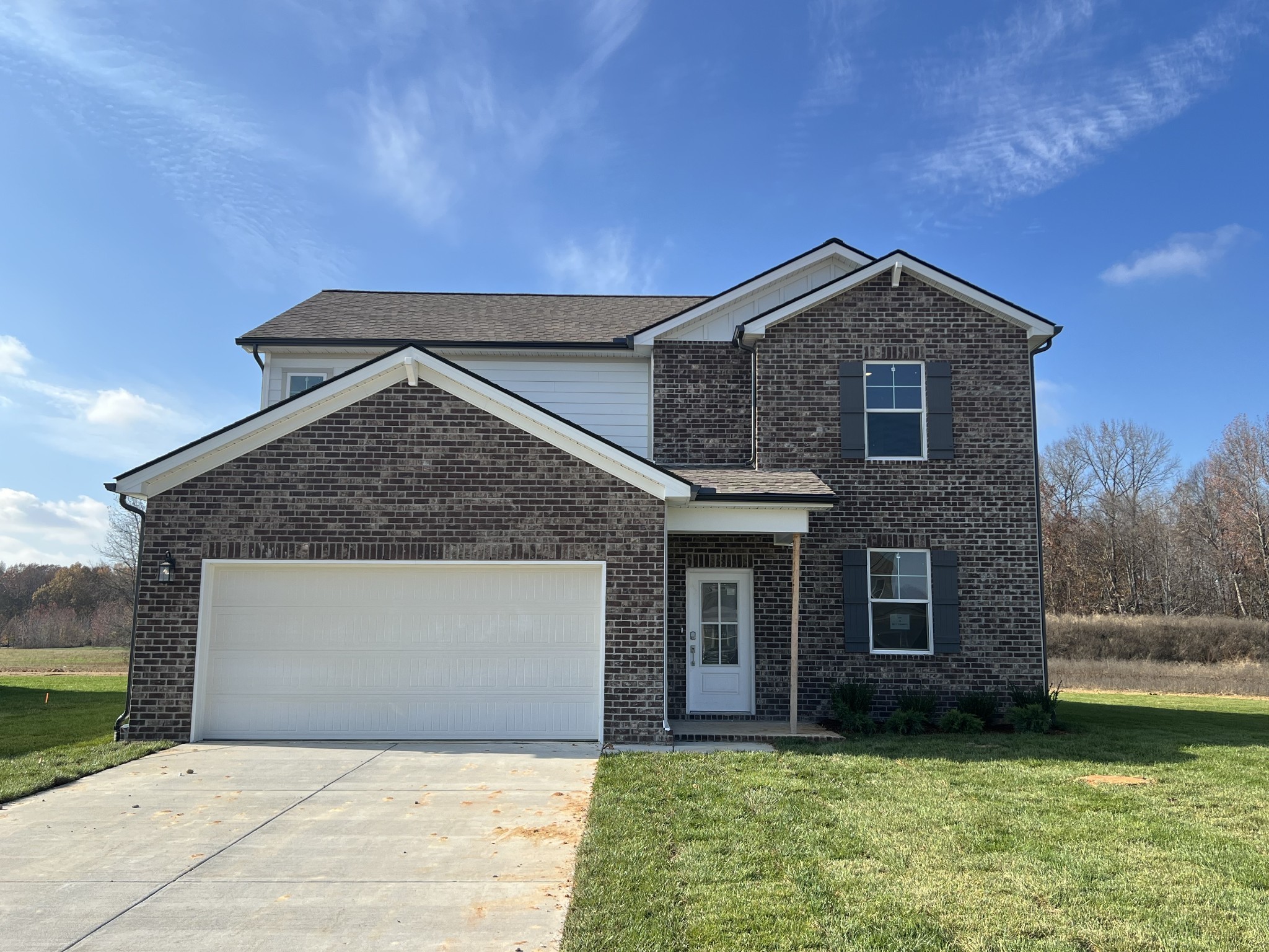 Actual home under construction 12/1. Beautiful tree-lined lot!