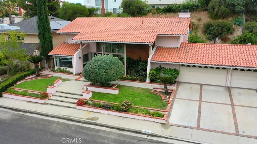 an aerial view of a house with garden