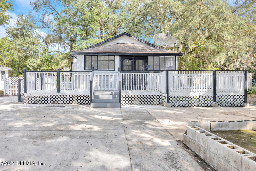 a front view of a house with a gate