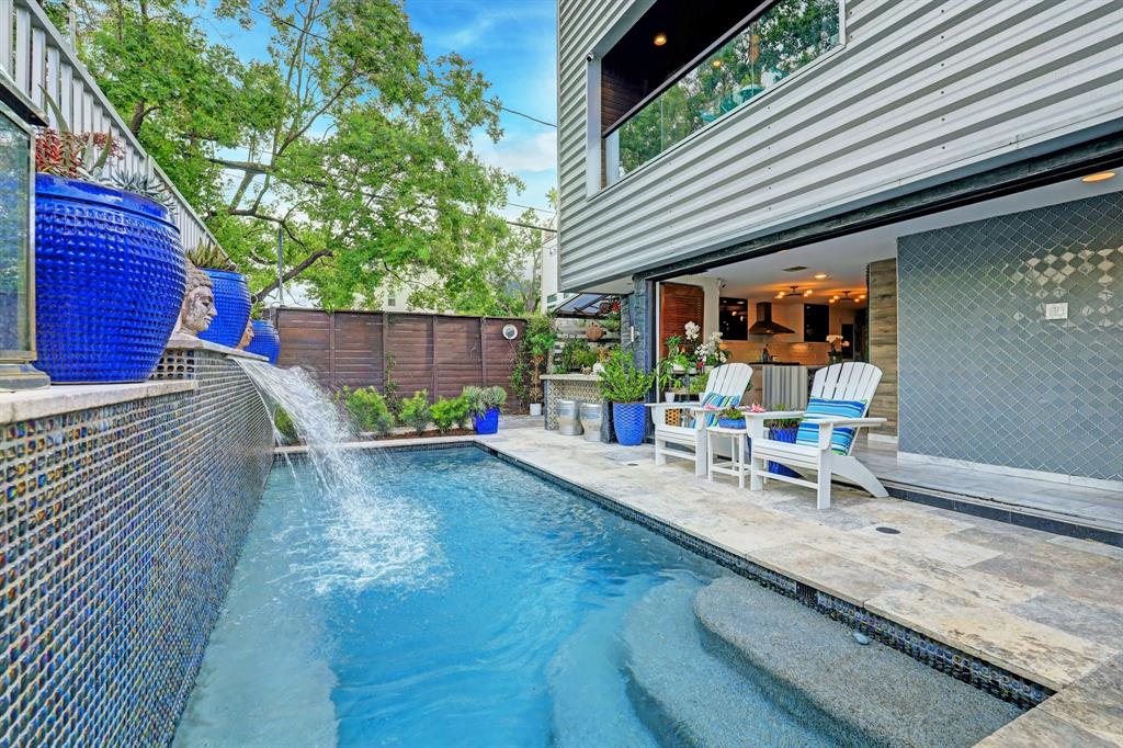 a view of a backyard with sitting area