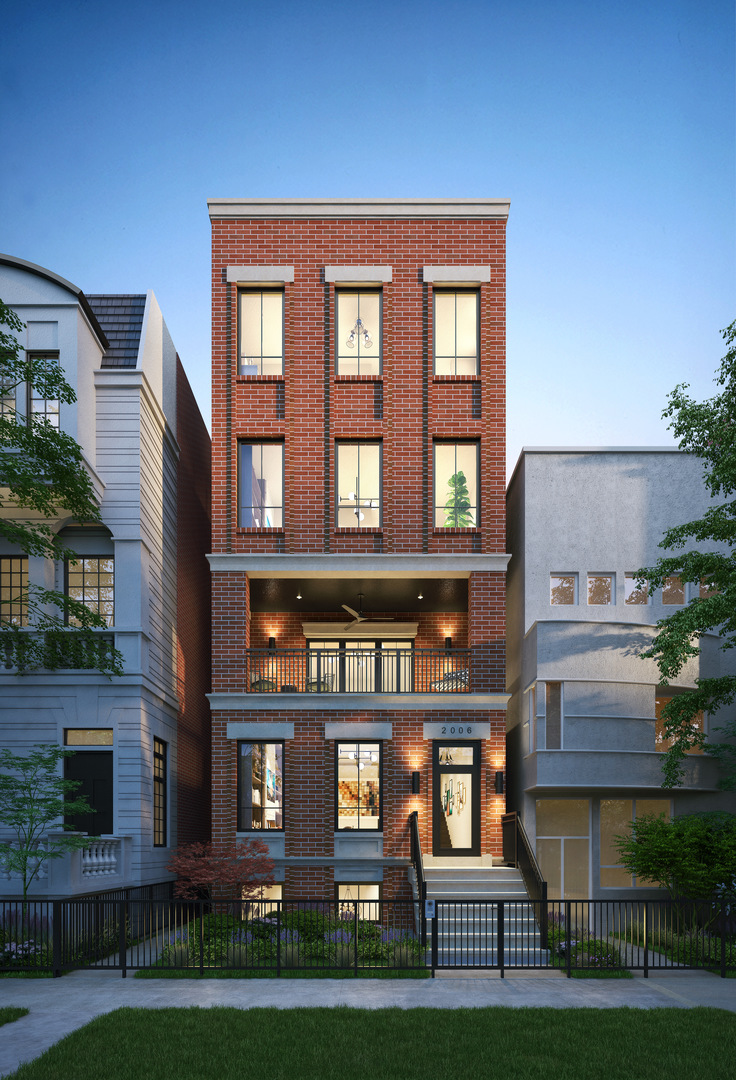 a view of a brick building next to a yard