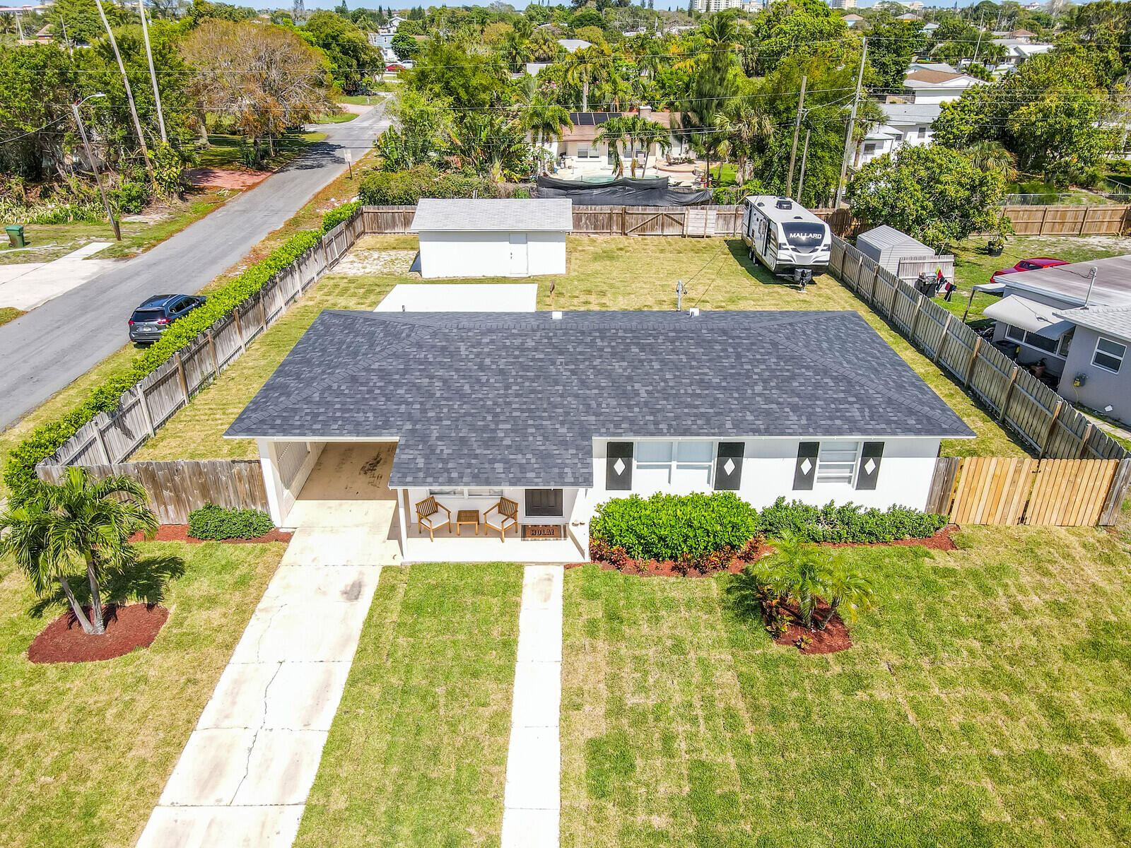 a aerial view of a house with swimming pool