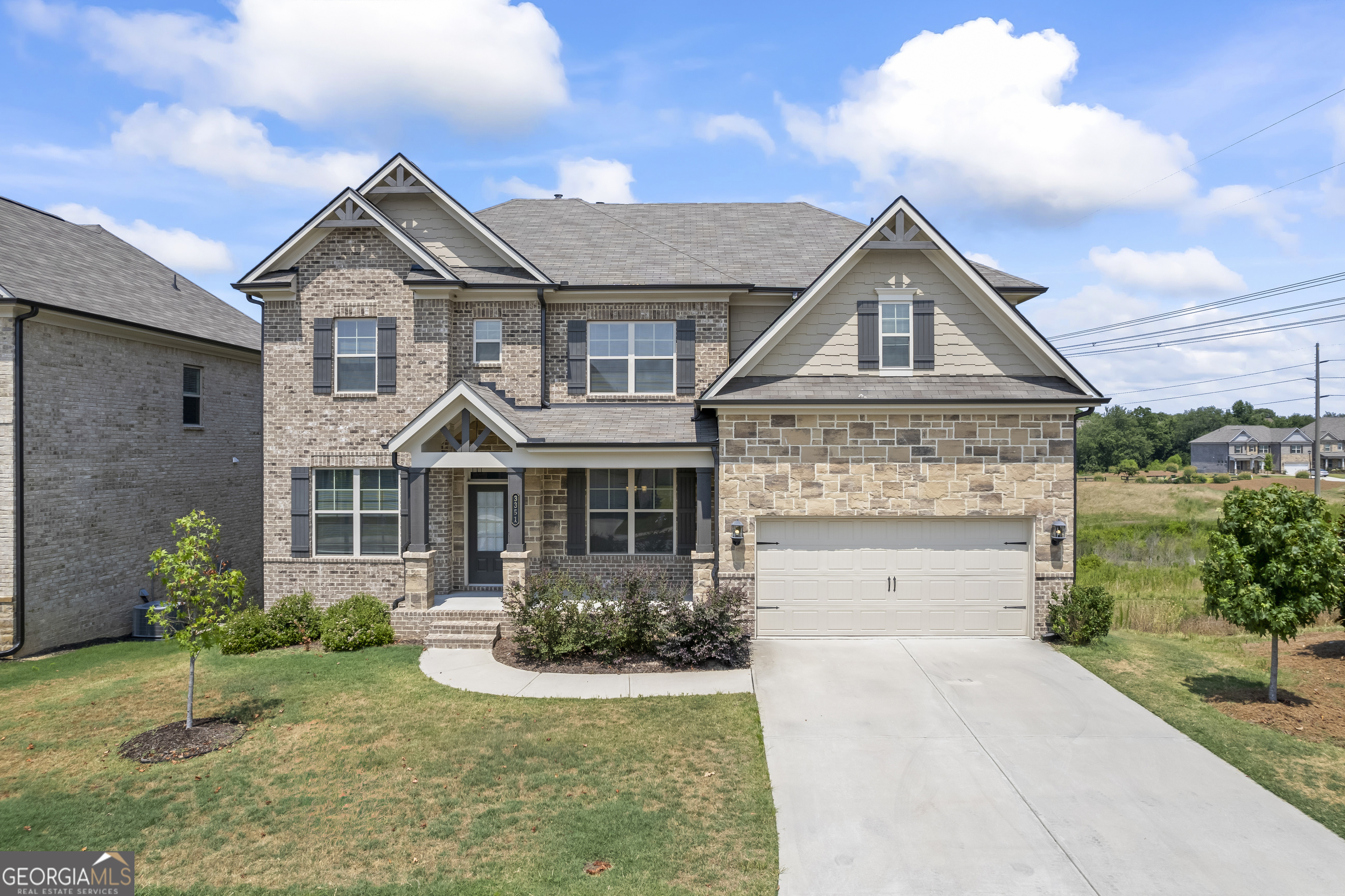 a front view of a house with a yard