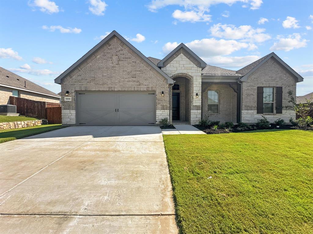 a front view of a house with yard