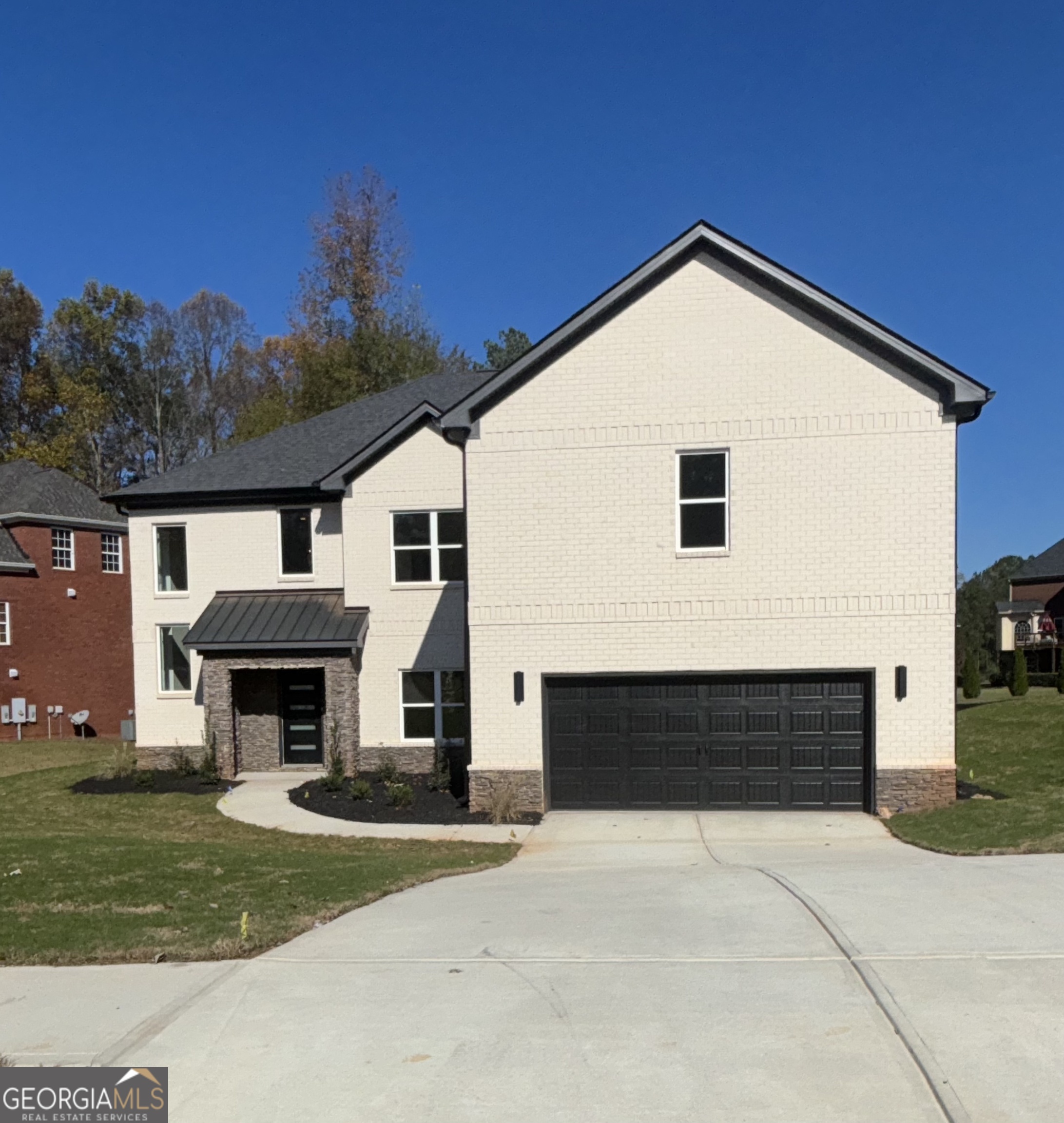 a front view of a house with a yard