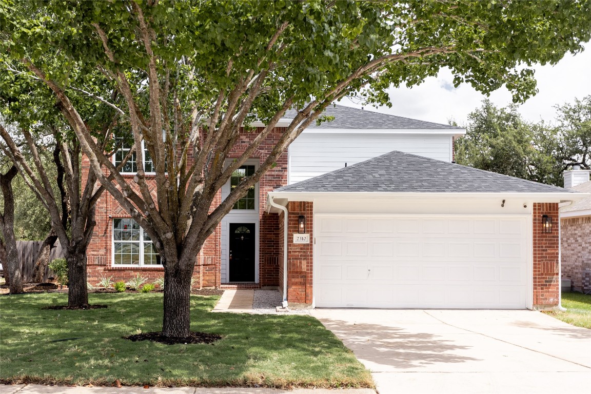 a front view of house with yard