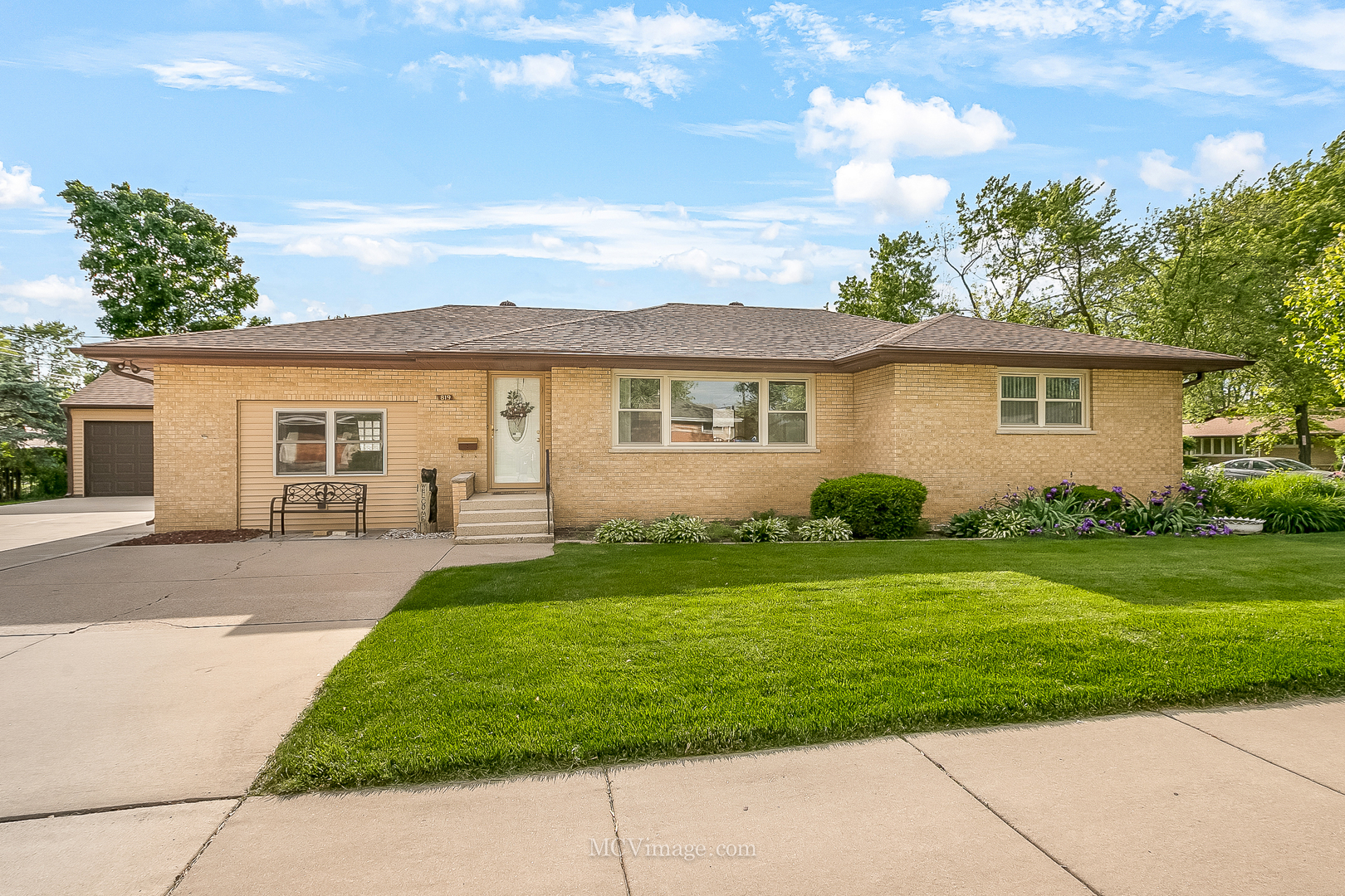 front view of a house with a yard