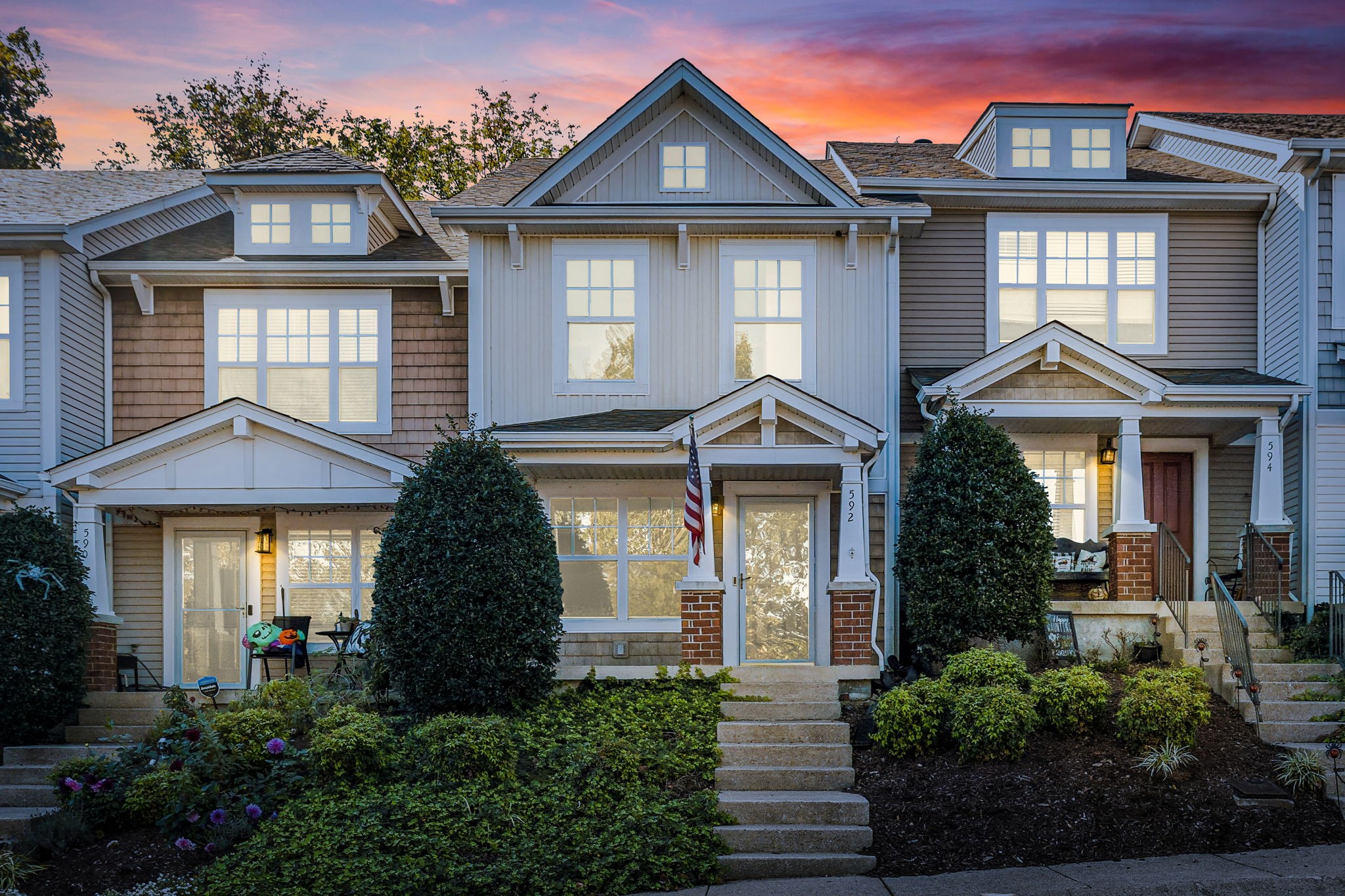 a front view of a house with a yard