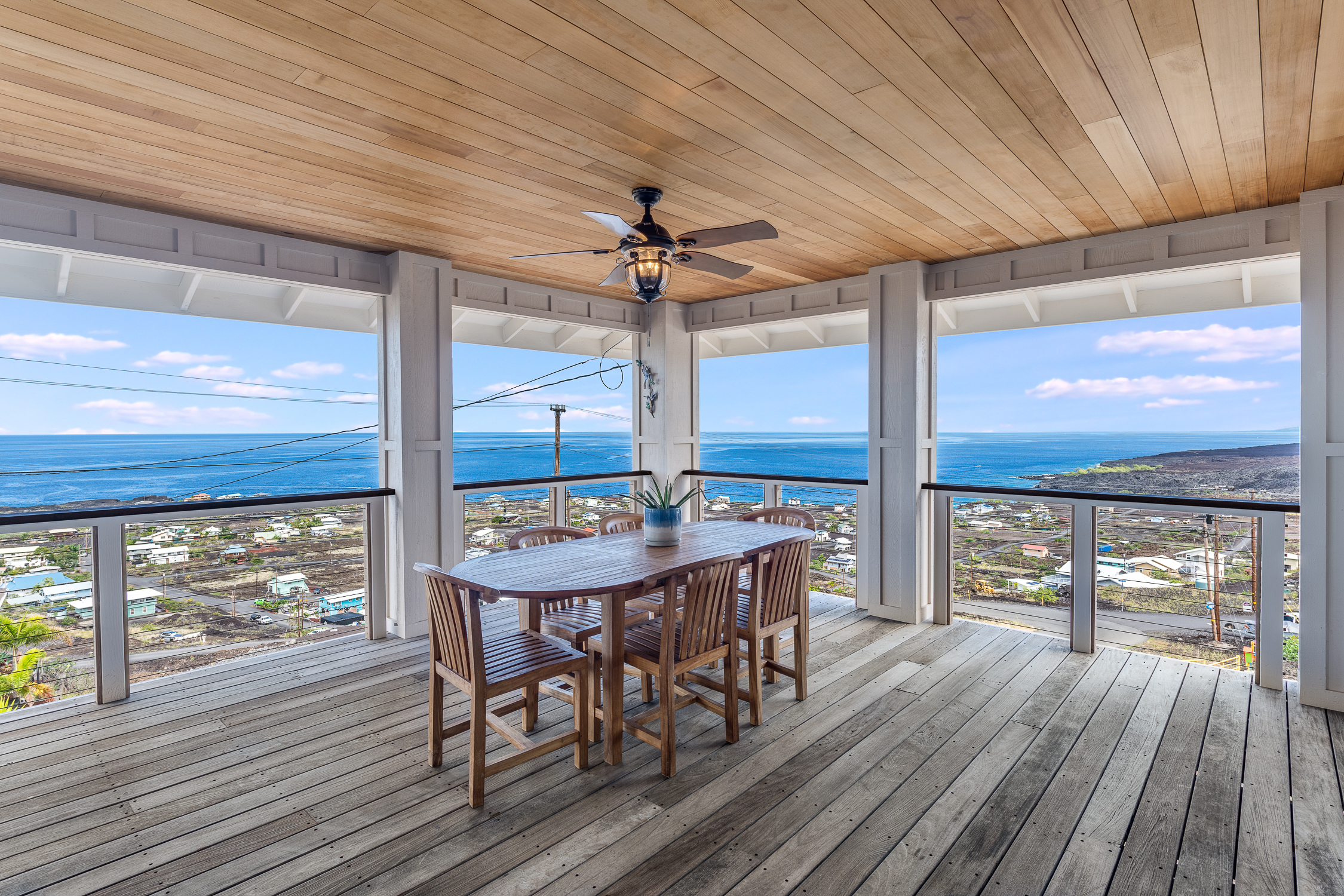 a view of a patio with table and chairs with wooden floor